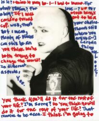 Black-and-white Polaroid of a police officer wearing makeup, with text in blue and red ink on surface
