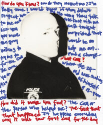 Black-and-white Polaroid of a police officer with text in blue and red ink on surface