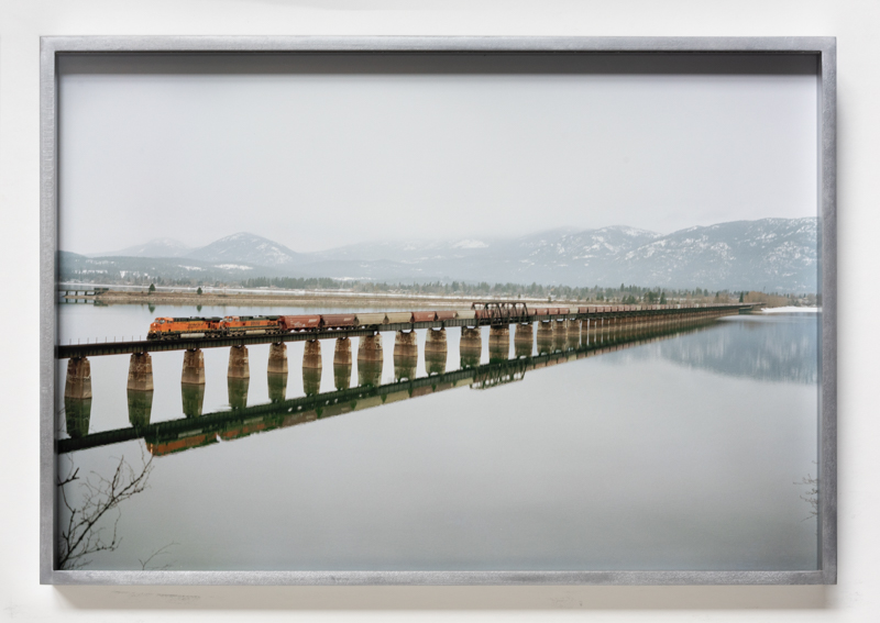 Justine Kurland. Long Bridge Over Lake Pend Oreille, 2009, pigment print, 19 x 13 inches // Red Chair, 2008, pigment print, 9 x 7 1/8 inches, printed 2023, mounted on aluminum, 19 x 13 inches, edition of 6